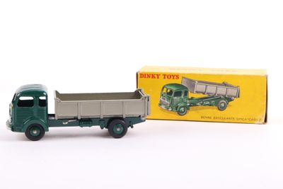 a green toy truck with a box on the back of it
