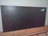a picture of a black board with a white bird on it