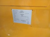a label on the back of a yellow truck