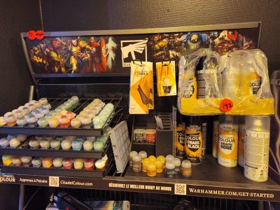 a display of paint and supplies for sale in a store