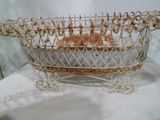 a metal basket with a basket of food inside of it