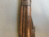 a wooden object that is hanging on the wall