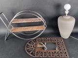 a table with a mirror, a lamp, and a picture frame