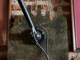 a lamp that is on a brick wall next to a picture