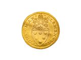 gros plan d'une pièce d'or sur fond blanc