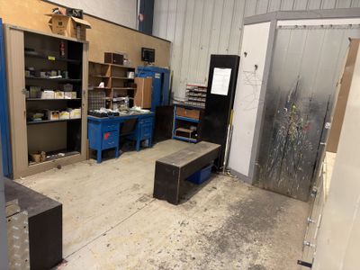 an image of a room that has a lot of work in it