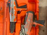 a tool box with a hammer, a hammer, and a nail brush