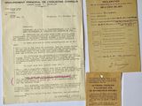 some old papers are sitting on a table with a pen and paper