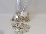 a bag full of coins sitting on a table