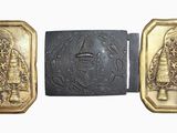 two gold and silver metal plaques with a picture of a man and woman