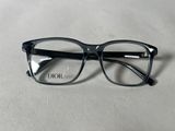 black glasses with clear lenses on a white surface