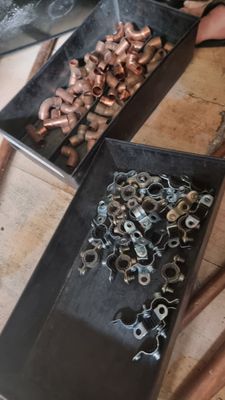 two trays of nuts and a pair of scissors on a table