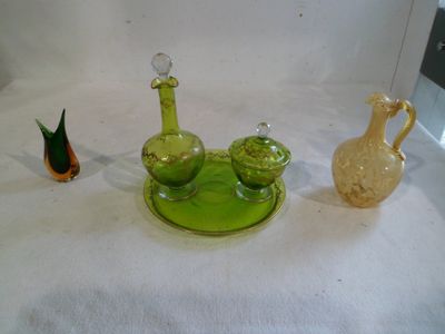 three glass vases sitting on a white table cloth