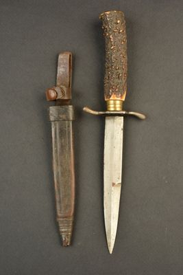 a knife and a knife holder sitting on a table