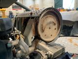 a close up view of a engine in a garage