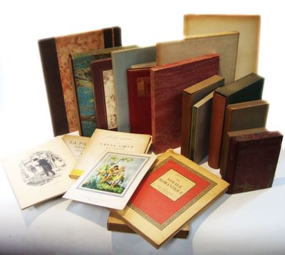 a lot of books that are sitting on a table