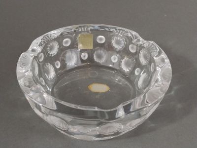 a clear glass bowl with a small yellow object in it