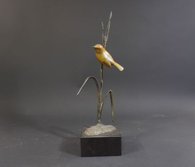 bronze sculpture of a bird perched on a branch on a marble base