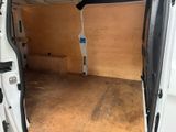 a white van with a door open in a garage