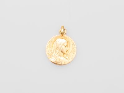 a gold coin with a woman ' s face on it
