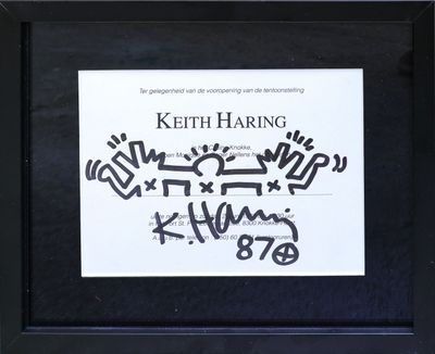 a black and white photo of a sign with graffiti written on it