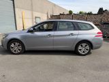 a picture of a silver car parked in a parking lot
