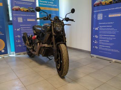 a motorcycle that is parked in a showroom