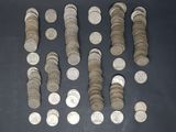 a lot of coins that are on the table