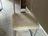 a chair that is sitting in the corner of a room