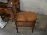 a chair that is sitting in front of a piano