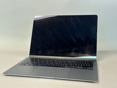 an open laptop computer sitting on top of a white table