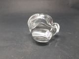 a glass cup that is sitting on a table