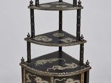 an image of a black and gold three tiered display case