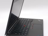 the laptop is open on a white surface with a black keyboard