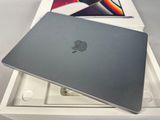 an apple macbook pro laptop in a box with the lid open