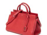 a red handbag on a white background