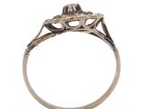 a close up of a diamond ring on a white background