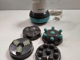 a black and white steam iron and some buttons