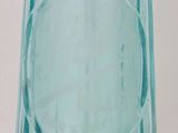 a blue glass vase that is sitting on a table