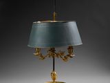 an image of a table lamp with a green shade on it