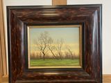 painting of a bare tree on a shelf in front of a white wall