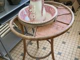 a small table with a pitcher on top of it