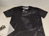 the shirt is black and white with a picture of a cat on it