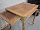 a small table with a drawer on top of it