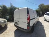 a white van that is parked in a parking lot