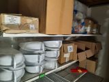 many plates and pans on the shelves in the kitchen