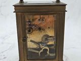 a small clock that is sitting on a table