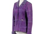the jacket is made of purple sued and has a sherpack