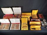 many different types of knives and knives in a box