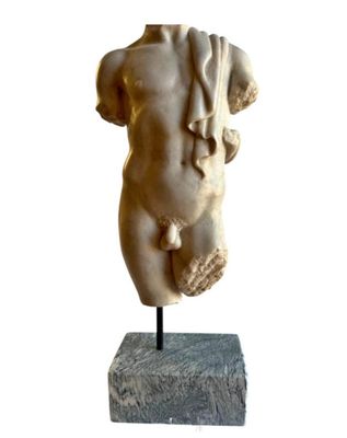 marble statue of a female torso on a marble base
